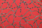 Tissu Polyester Extensible Rouge Imprimé Chaines Gold -Au Mètre