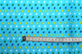 Tissu Popeline Coton Imprimé Fond Turquoise Étoiles colorées -Au Mètre