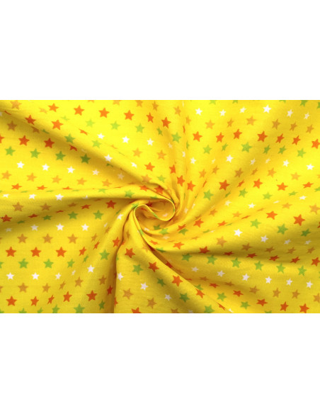 Tissu Popeline Coton Imprimé Fond Jaune Étoiles colorées -Au Mètre