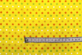 Tissu Popeline Coton Imprimé Fond Jaune Étoiles colorées -Au Mètre